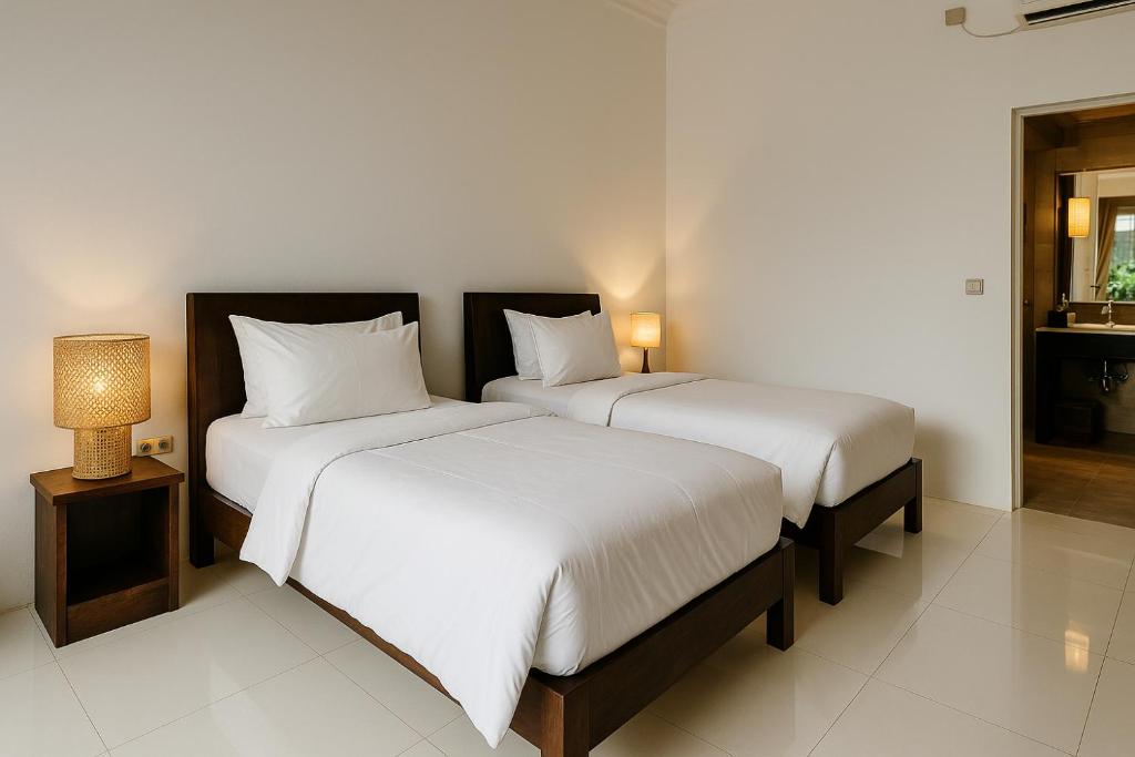 Postel nebo postele na pokoji v ubytování Lumiere Hotel Gili Trawangan
