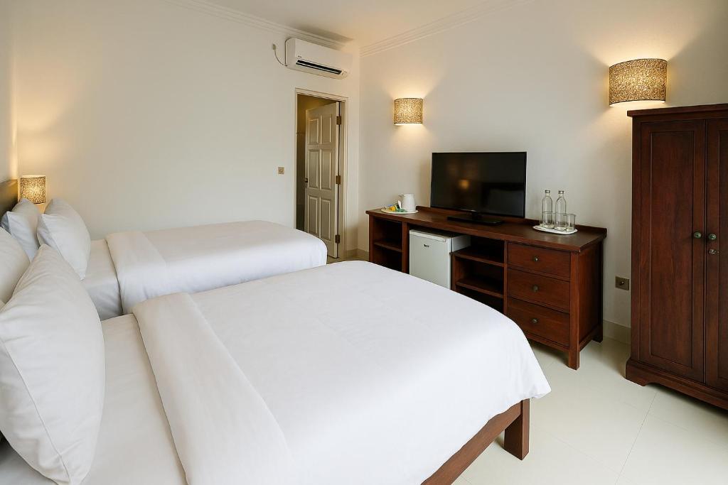 TV a/nebo společenská místnost v ubytování Lumiere Hotel Gili Trawangan