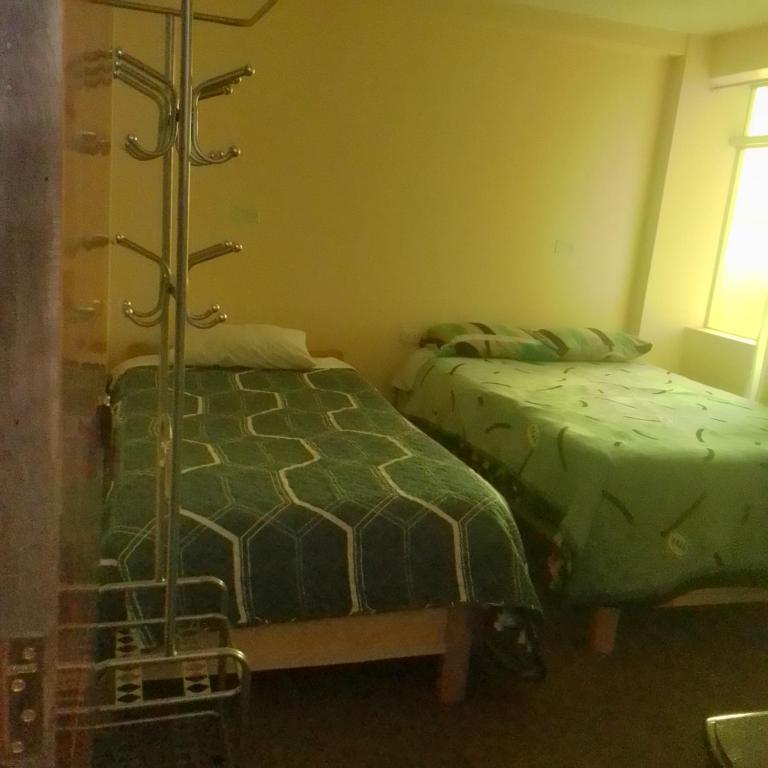 Postel nebo postele na pokoji v ubytování killa andina inn