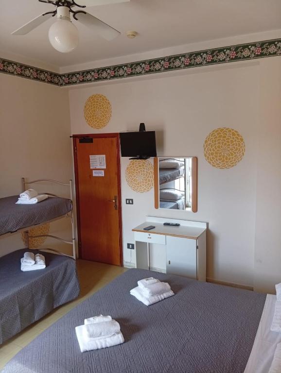 Postel nebo postele na pokoji v ubytování Smile Beach Hotel Nuova Gestione