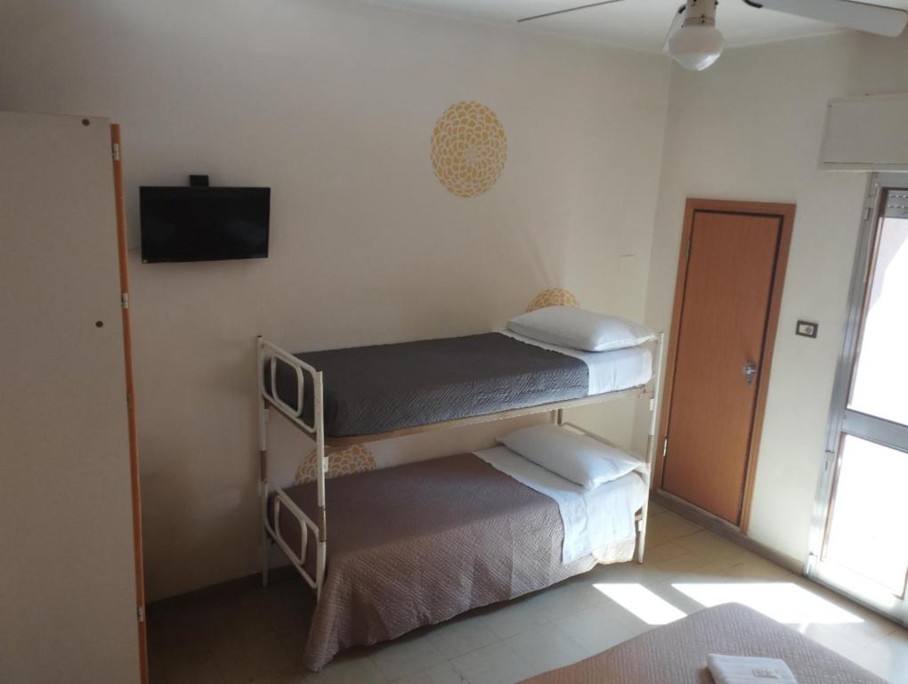 Postel nebo postele na pokoji v ubytování Smile Beach Hotel Nuova Gestione