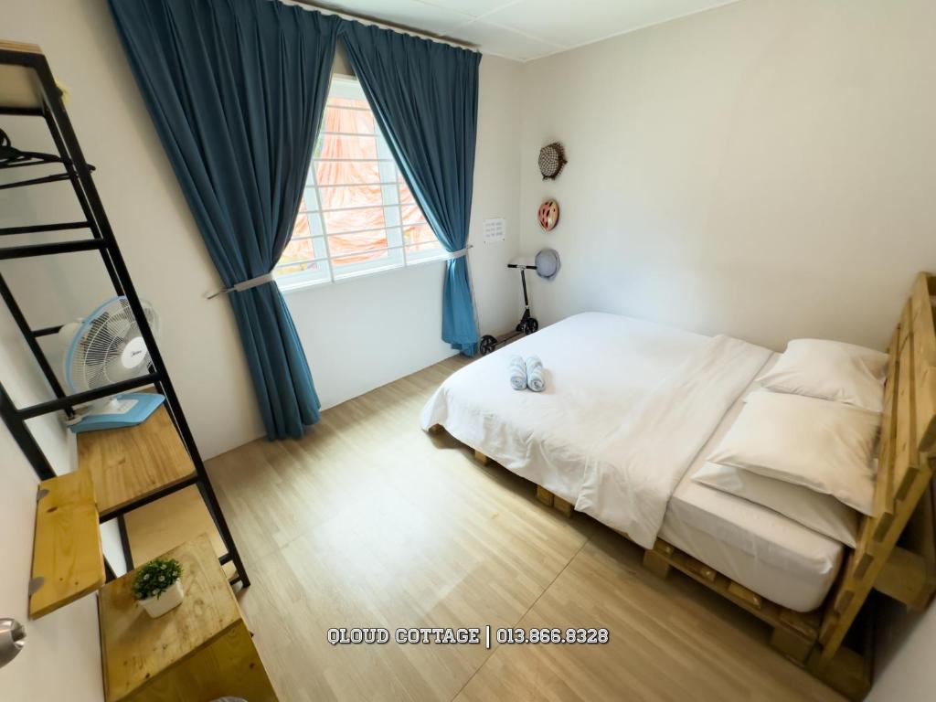 Postel nebo postele na pokoji v ubytování Qloud Cottage