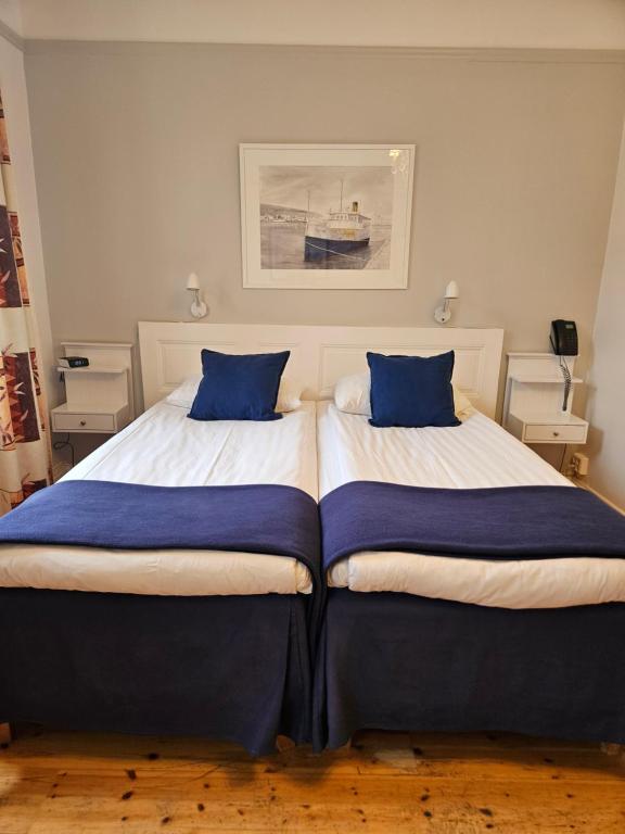 Postel nebo postele na pokoji v ubytování Hotel Emma