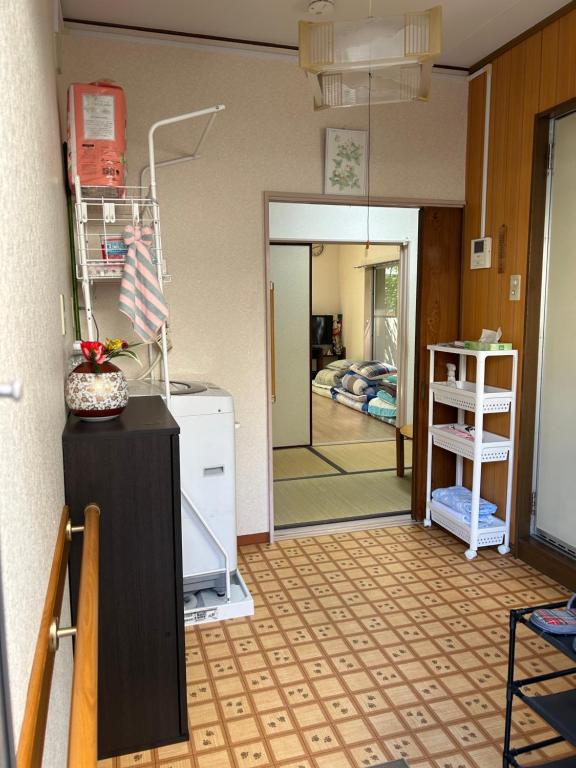 Küche&#47;Küchenzeile in der Unterkunft ハイツドリーム梦想小屋