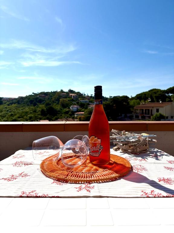 a bottle of hot sauce sitting on a table at Consumella24 in Portoferraio