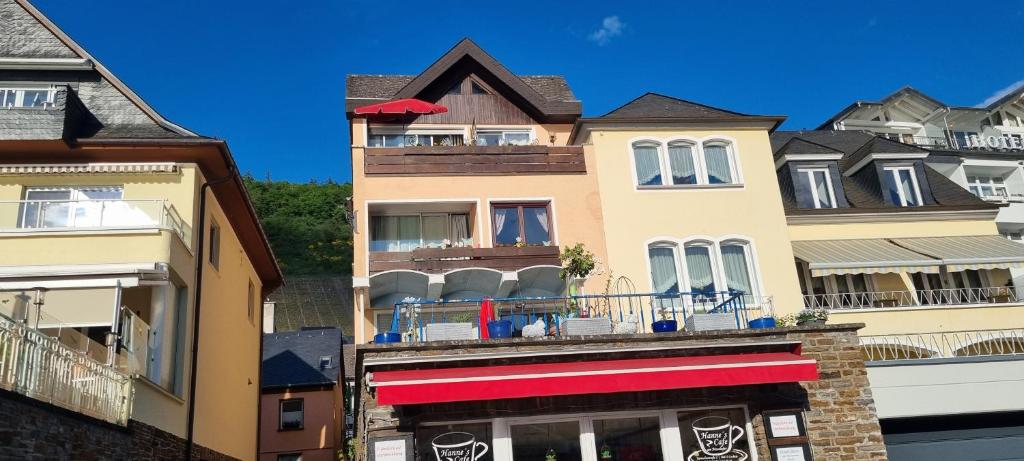 a building with a balcony with skulls on it at Pension Regina in Cochem