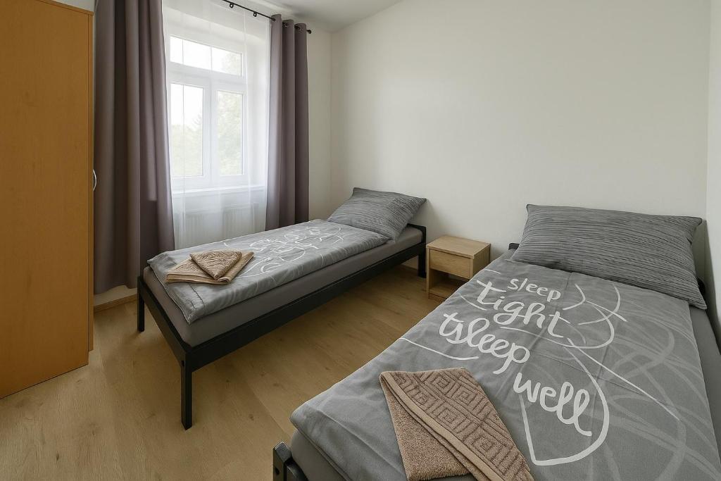 Postel nebo postele na pokoji v ubytování Apartmány Sport