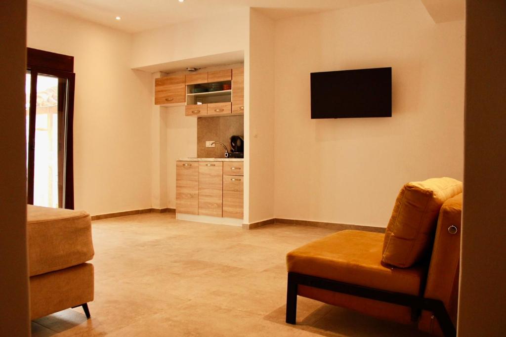 TV a/nebo společenská místnost v ubytování Cicones Boutique Apartments