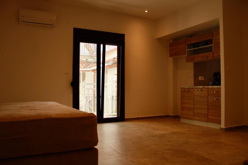 Postel nebo postele na pokoji v ubytování Cicones Boutique Apartments