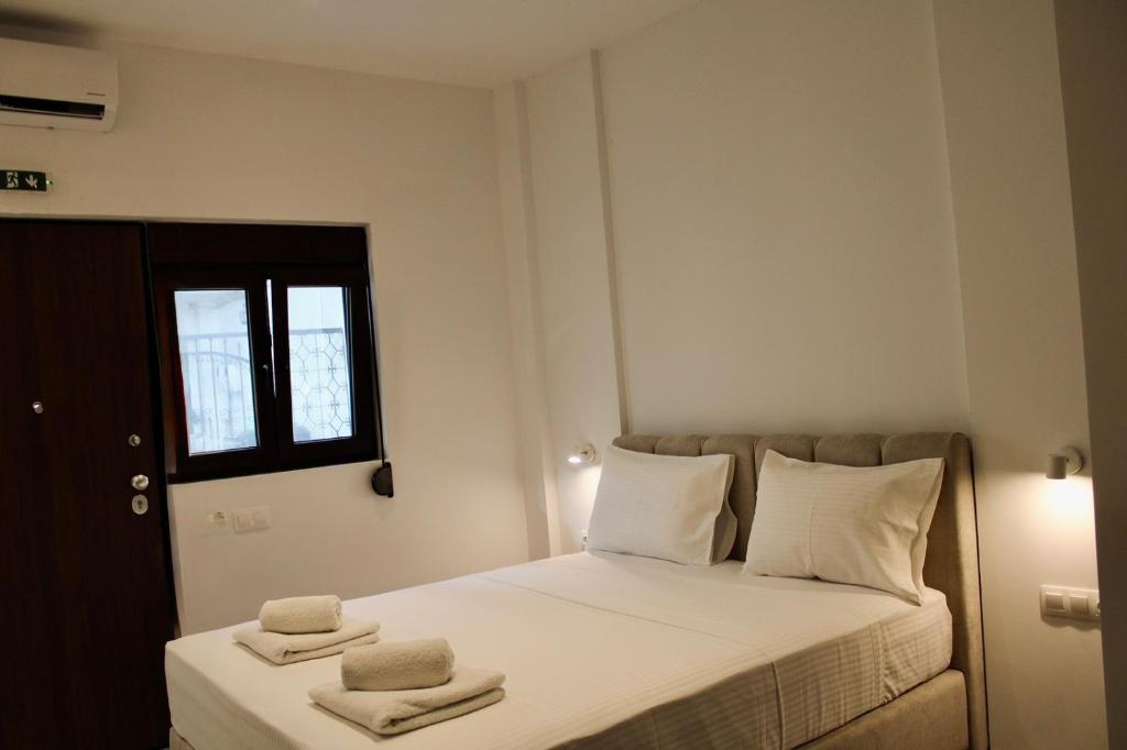 Postel nebo postele na pokoji v ubytování Cicones Boutique Apartments