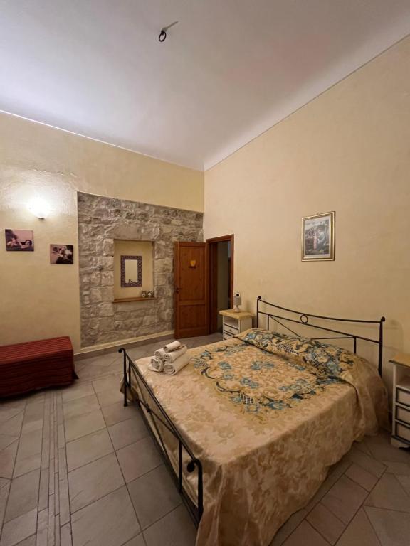 Posteľ alebo postele v izbe v ubytovaní B&b Candido Vacanze