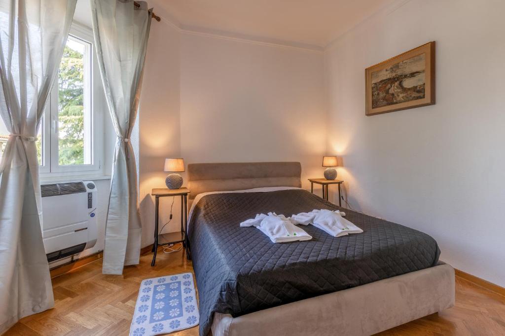 Postel nebo postele na pokoji v ubytování Vista&Capriccio