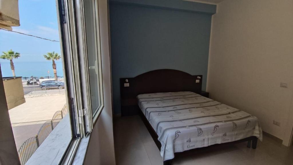 Ένα ή περισσότερα κρεβάτια σε δωμάτιο στο Beach Apartments & Rooms