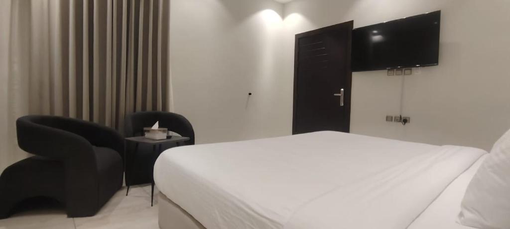 Postel nebo postele na pokoji v ubytování حكاية مسكن