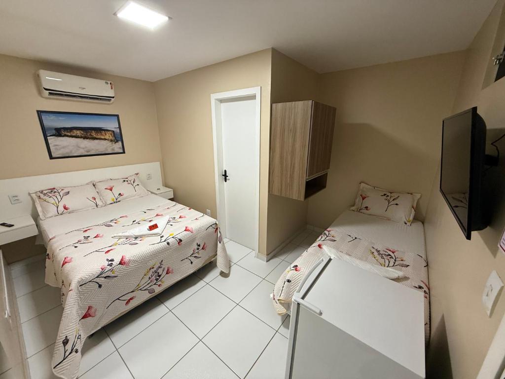 Postel nebo postele na pokoji v ubytování Roraima Apart Hotel