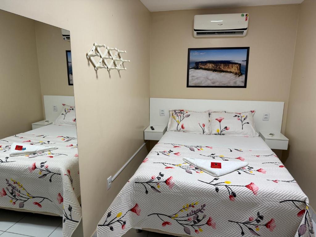 Postel nebo postele na pokoji v ubytování Roraima Apart Hotel