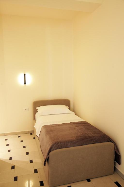 Ένα ή περισσότερα κρεβάτια σε δωμάτιο στο Mejsi Studio Apartment