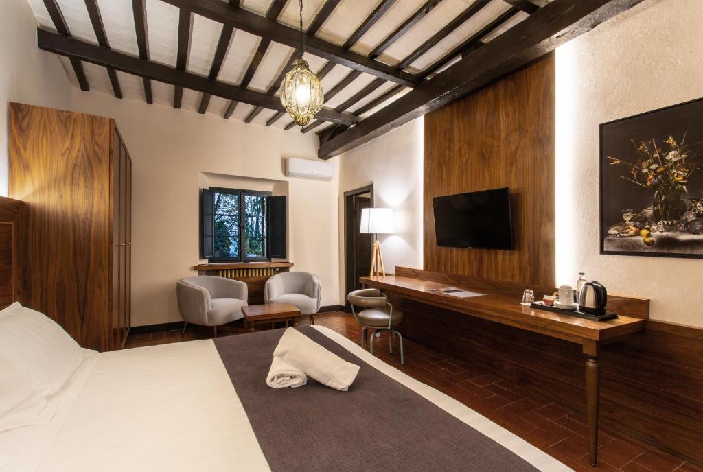 TV a/nebo společenská místnost v ubytování La Loggia Historic Resort
