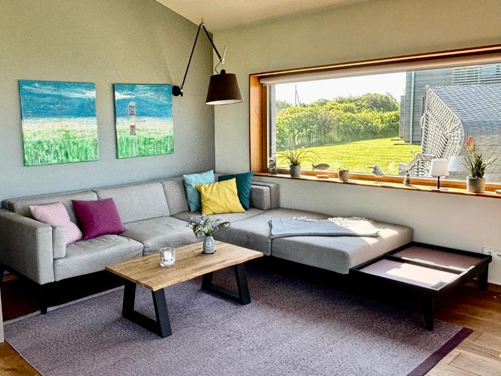 Posezení v ubytování Gud Jard Lodge Nr 17 - Design-Ferienhaus mit exklusiver Ausstattung