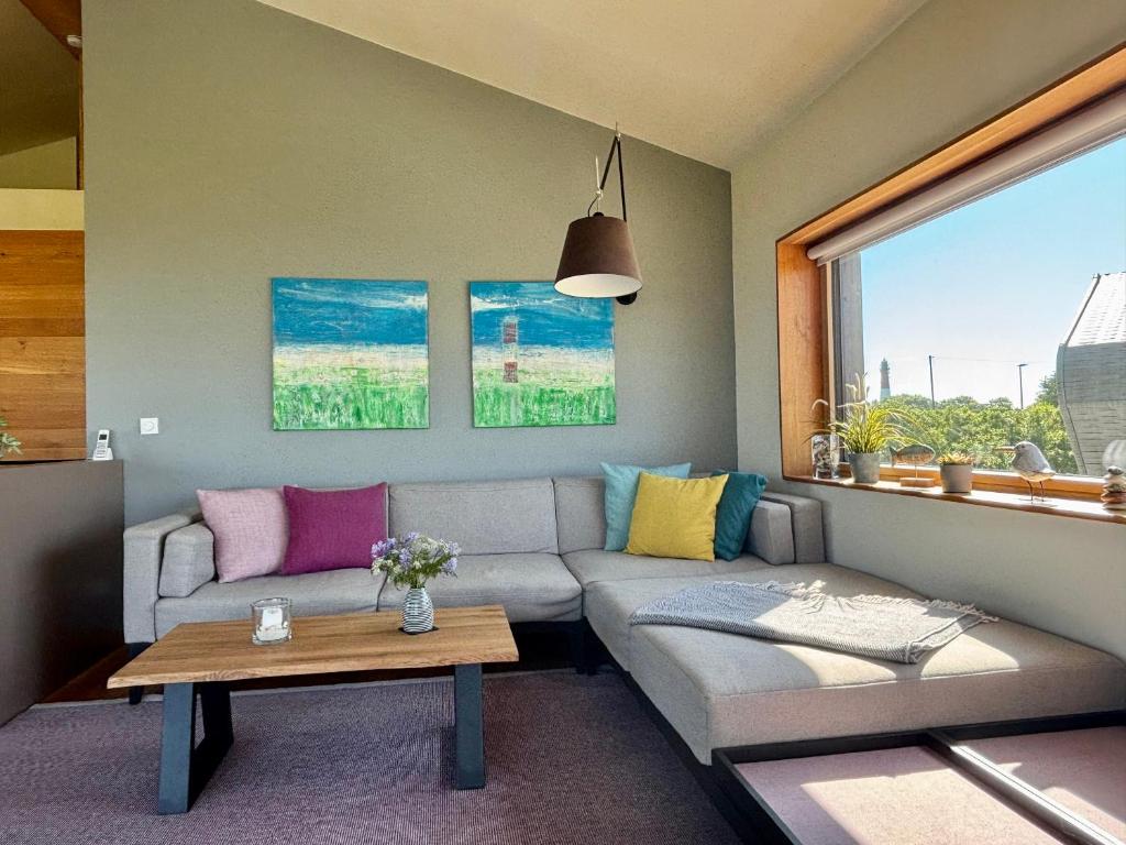 Posezení v ubytování Gud Jard Lodge Nr 17 - Design-Ferienhaus mit exklusiver Ausstattung