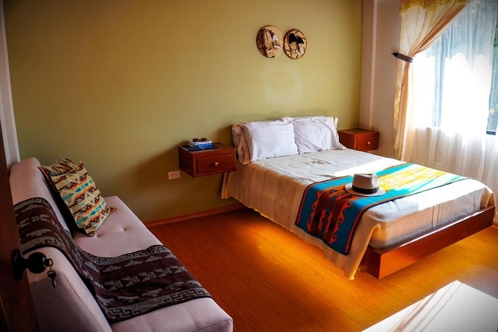 Postel nebo postele na pokoji v ubytování Laguna de Cuicocha Guest House
