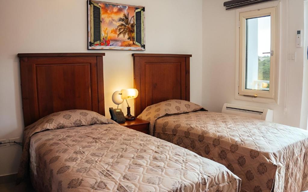 Postel nebo postele na pokoji v ubytování Saba Arawak Hotel
