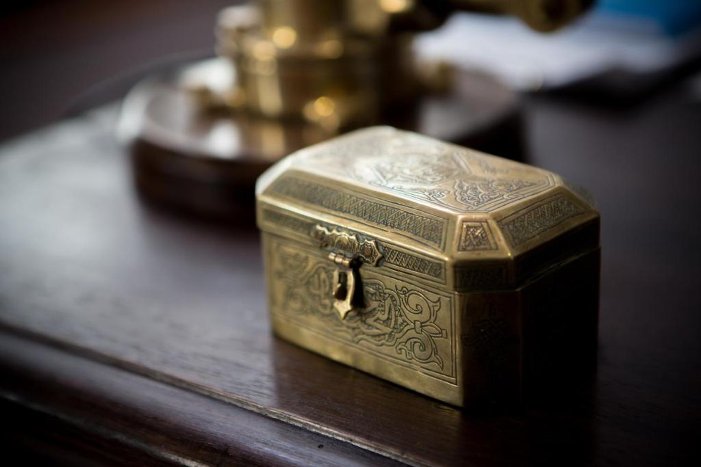 a gold box sitting on top of a table at Jawi Peranakan Mansion in George Town