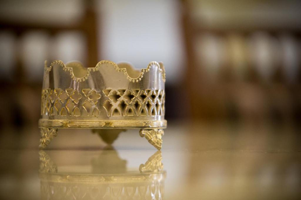 a gold chair sitting on a table at Jawi Peranakan Mansion in George Town