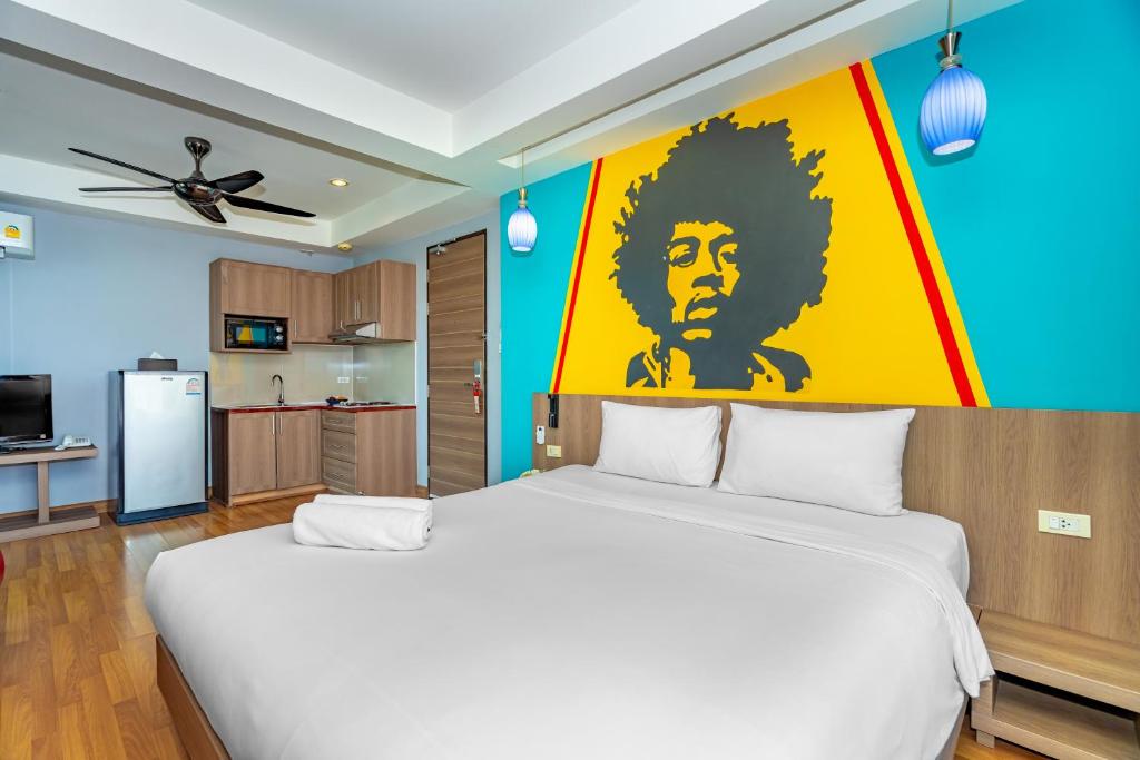 Postel nebo postele na pokoji v ubytování Anchan Boutique Hotel