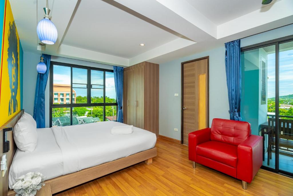 Postel nebo postele na pokoji v ubytování Anchan Boutique Hotel