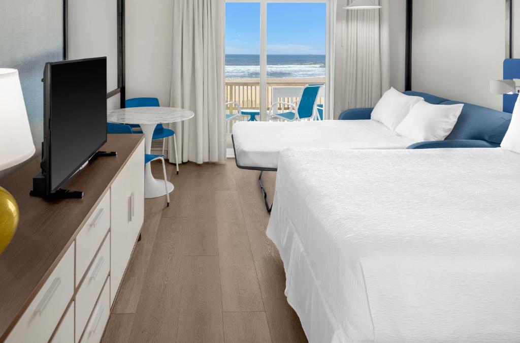 Postel nebo postele na pokoji v ubytování Montauk Blue Hotel