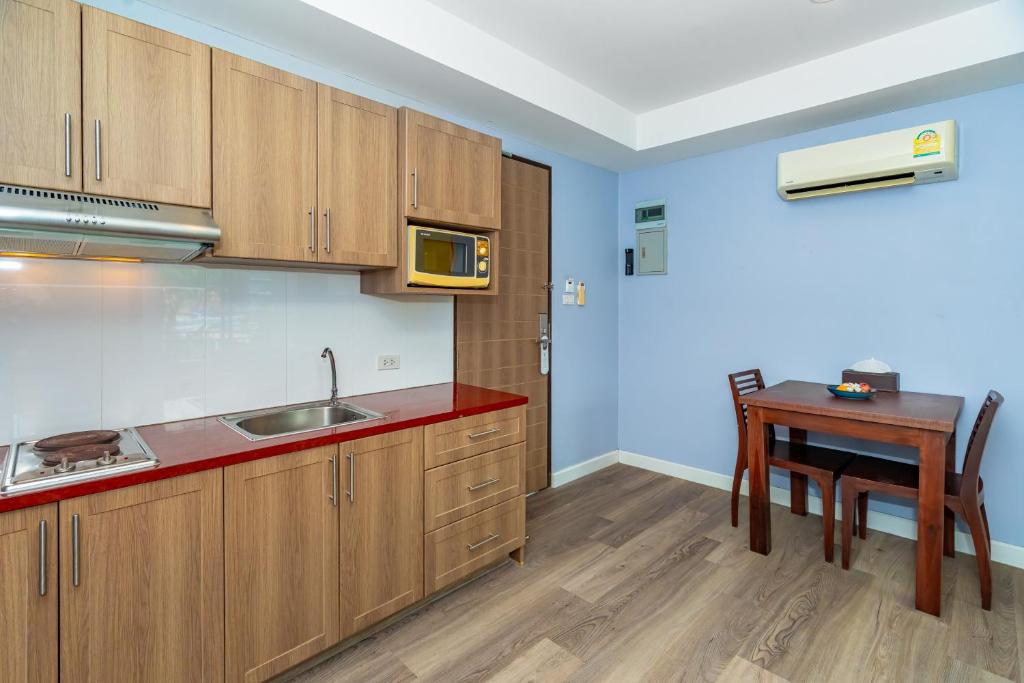 Kuchyň nebo kuchyňský kout v ubytování Anchan Boutique Hotel