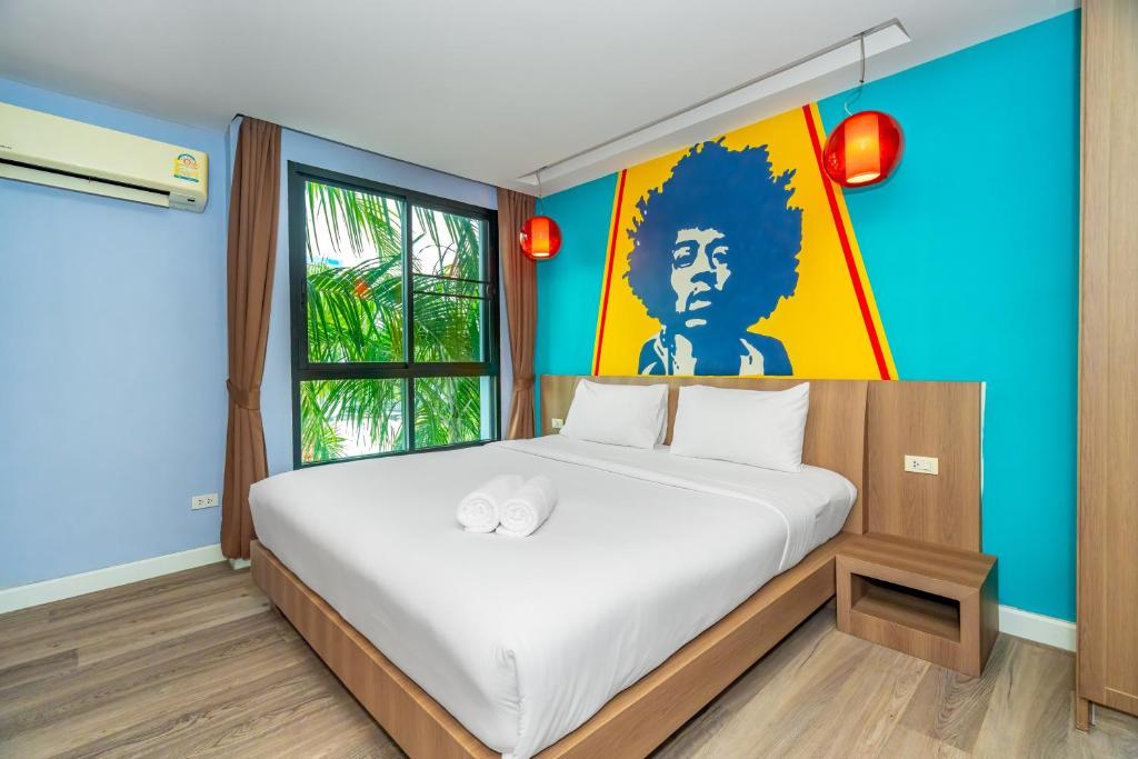 Postel nebo postele na pokoji v ubytování Anchan Boutique Hotel