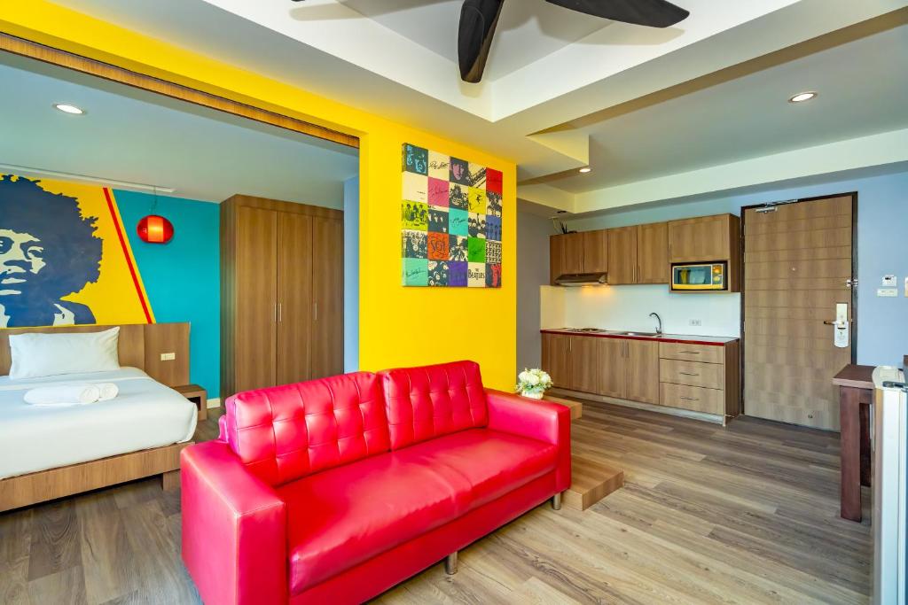 Postel nebo postele na pokoji v ubytování Anchan Boutique Hotel