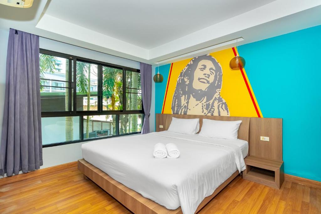 Postel nebo postele na pokoji v ubytování Anchan Boutique Hotel