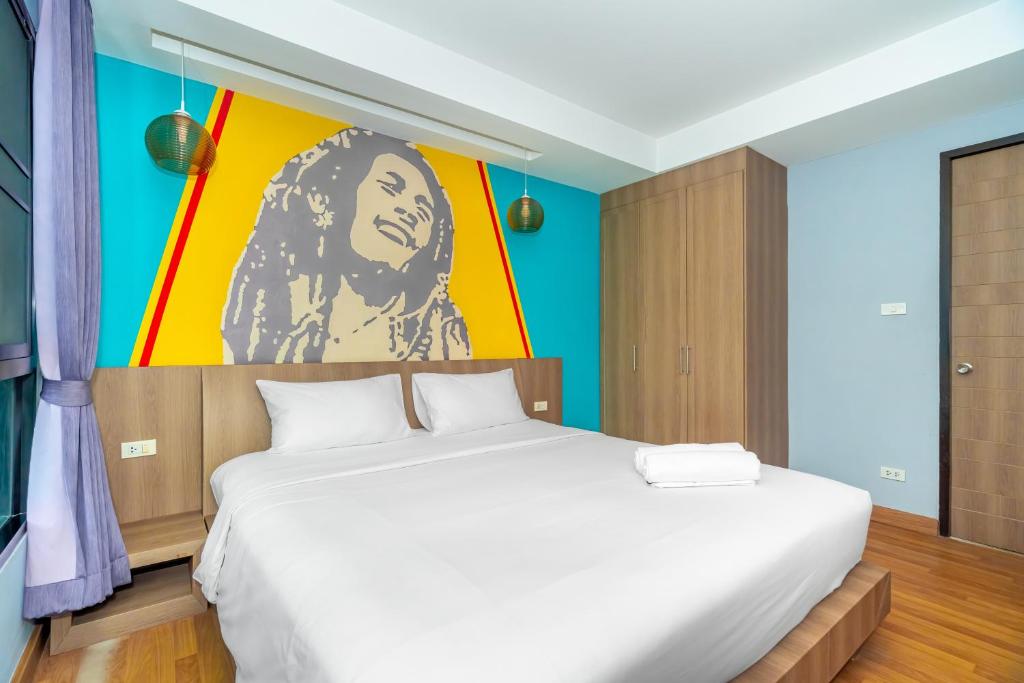 Postel nebo postele na pokoji v ubytování Anchan Boutique Hotel