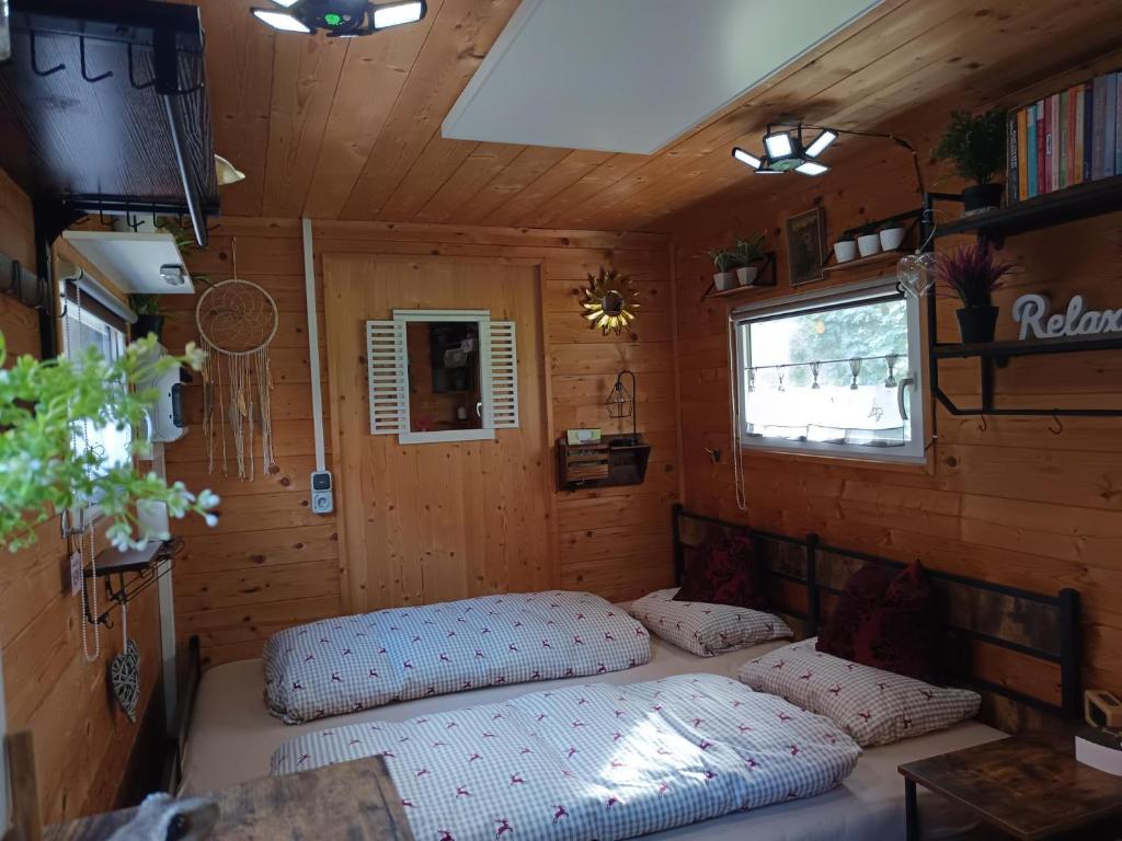 Postel nebo postele na pokoji v ubytování Die Alm in Schöllbüchl - Tiny House