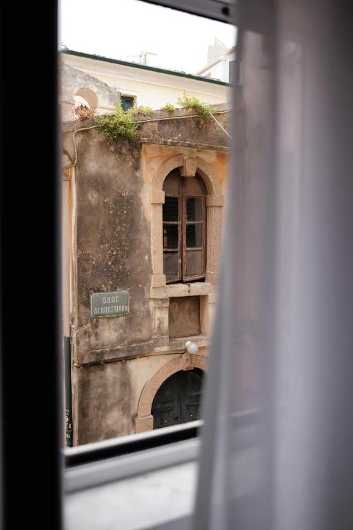a view of a building from a window at Kampana Corfu in luxury in Corfu