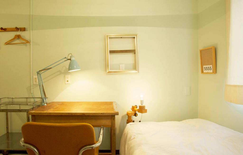 Postel nebo postele na pokoji v ubytování Apartment Hotel Shinjuku