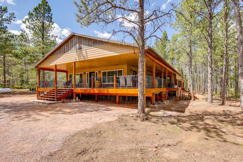 a large house in the middle of a forest at Black Hills Vacation Lodge New Home! Just Opened! in Newcastle