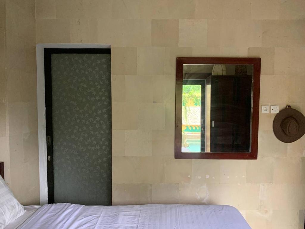 Postel nebo postele na pokoji v ubytování Cozy Palm Villa