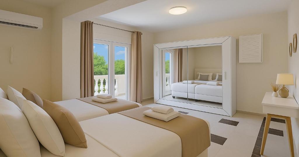 Postel nebo postele na pokoji v ubytování Villa Small Paradise