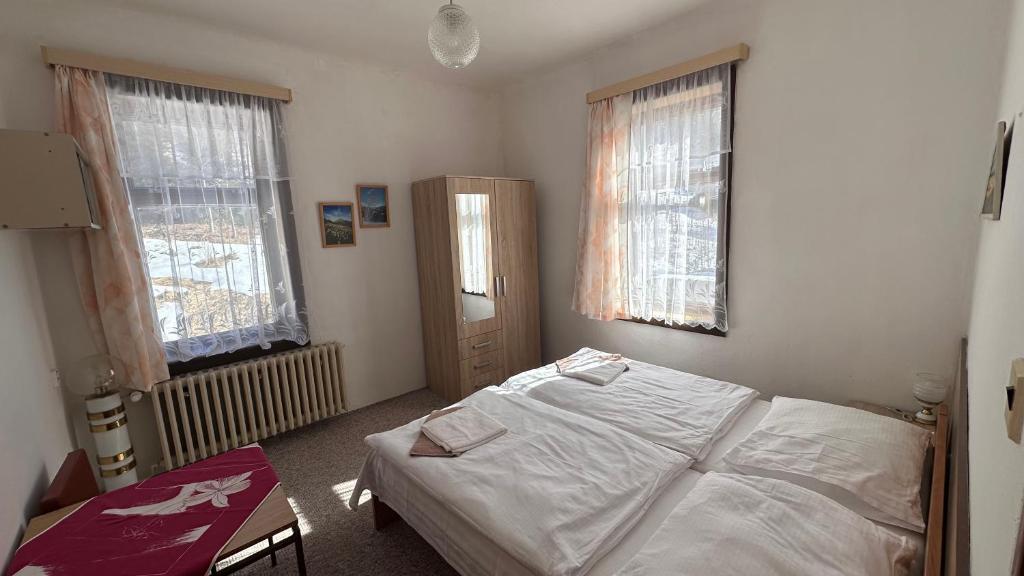 Postel nebo postele na pokoji v ubytování Hotel Zlatá vyhlídka