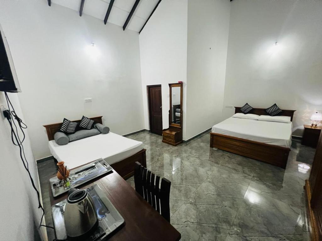 Postel nebo postele na pokoji v ubytování J&J resort