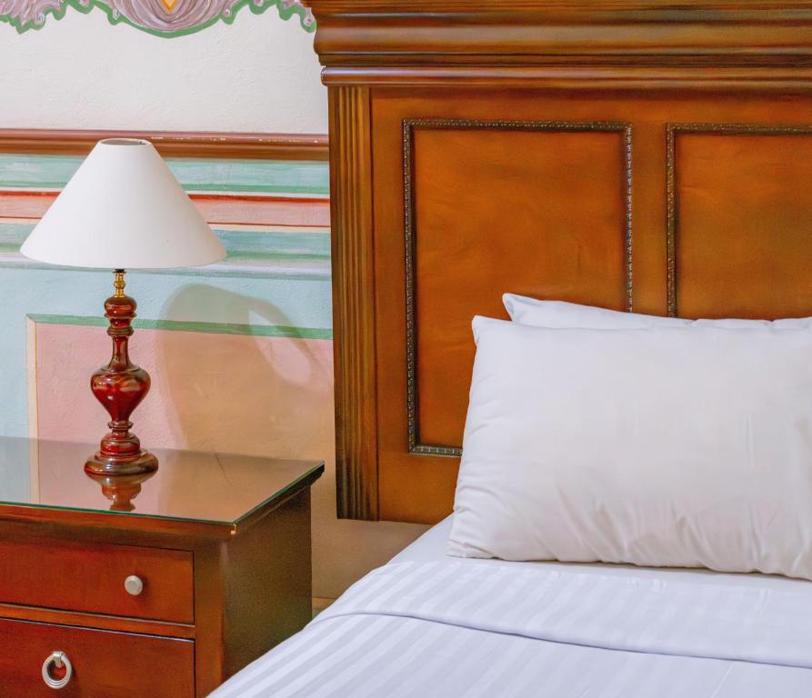 Postel nebo postele na pokoji v ubytování HOTEL CASONA MISIONES