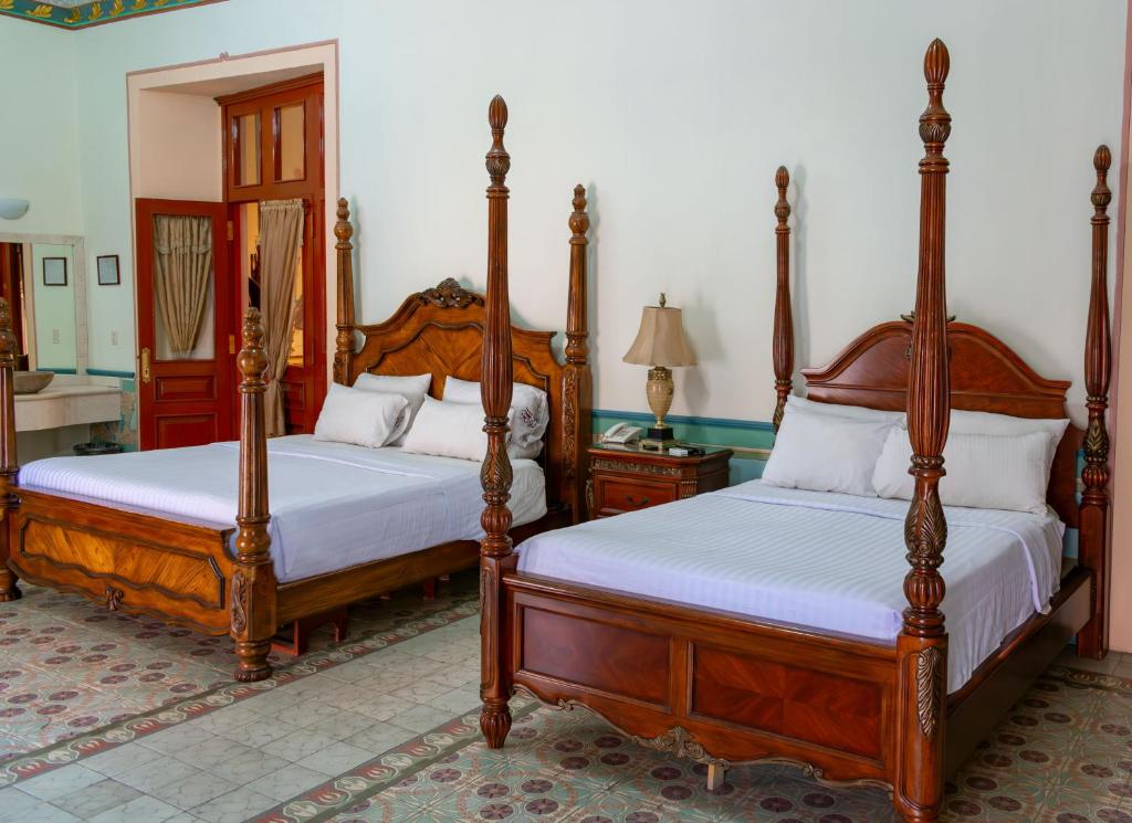 Postel nebo postele na pokoji v ubytování HOTEL CASONA MISIONES