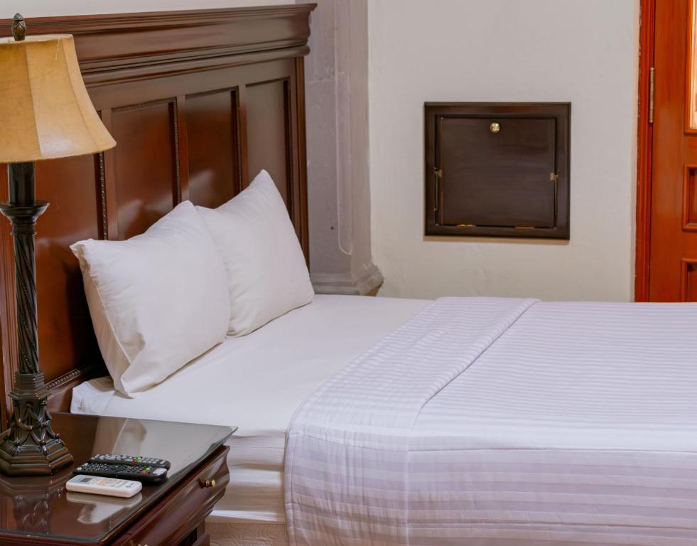 Postel nebo postele na pokoji v ubytování HOTEL CASONA MISIONES