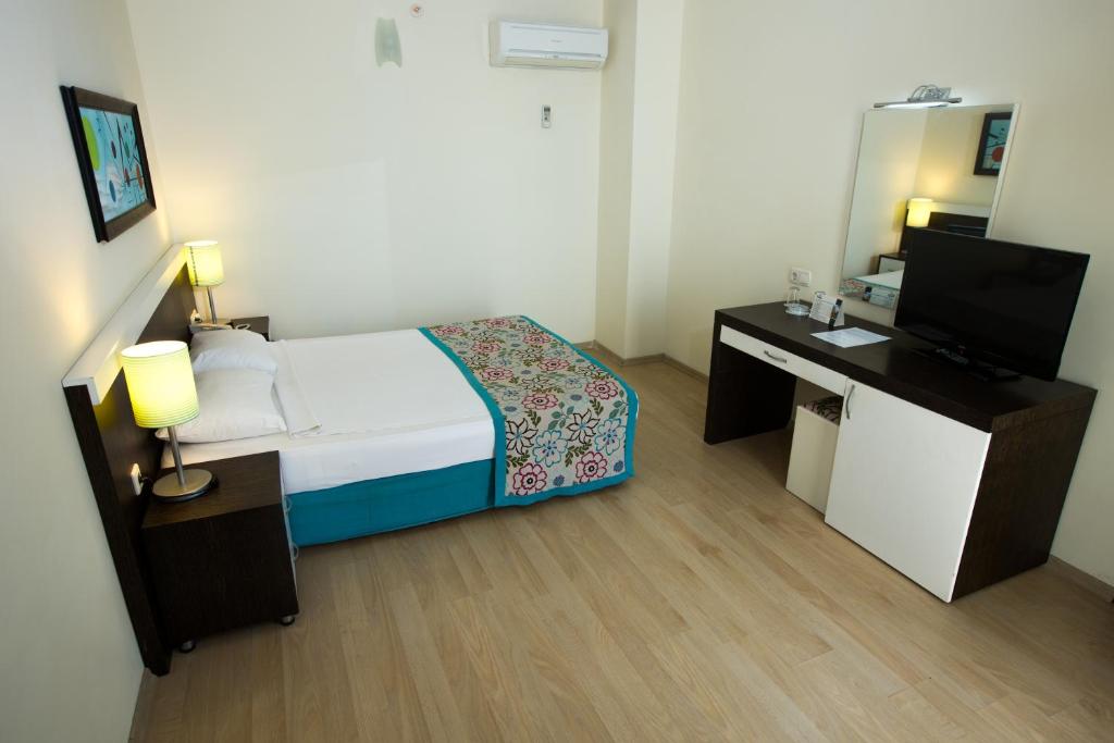 Postel nebo postele na pokoji v ubytování Dosi Hotel