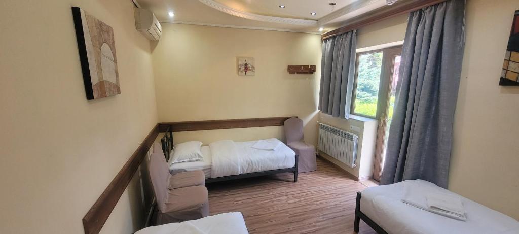 Postel nebo postele na pokoji v ubytování DALLAR Guest House