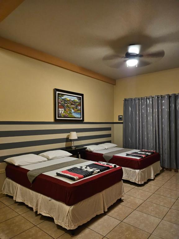 Postel nebo postele na pokoji v ubytování Platinum Hotel